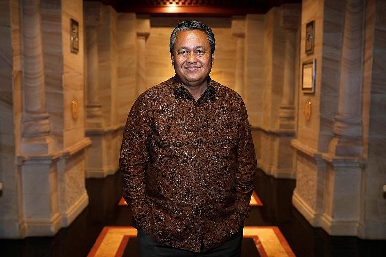 Bank Indonesia governor Perry Warjiyo, seen here at the central bank's headquarters in Jakarta, has been credited with doing the best he can to manage the volatile rupiah after assuming office in May, through measures such as imposing rate hikes and 