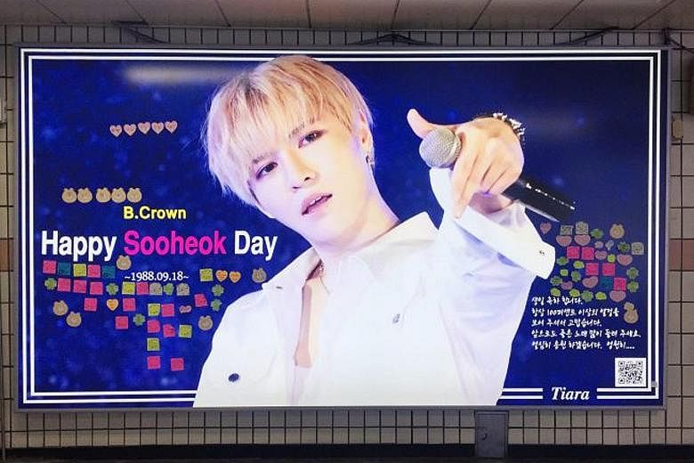 A birthday advertisement dedicated to K-pop celebrity Sooheok at Apgujeong station in Seoul.