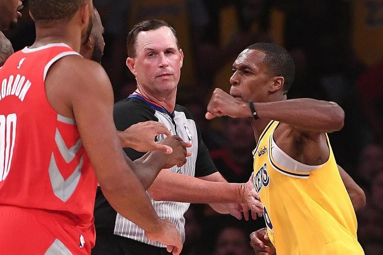Los Angeles Lakers guard Rajon Rondo (No. 9) throws a punch at Houston Rockets guard Chris Paul during the fight in the fourth quarter at Staples Centre.