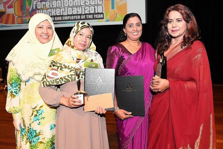 (From left) Employer Umi Saleha with her FDW Sri Wahyuni, who won the FDW of the year award; and FDW Sasenthu Kankanamge Suneetha Iranganie with her employer Bhamah Ramdas, who won the FDW employer of the year award, at yesterday's Foreign Domestic W