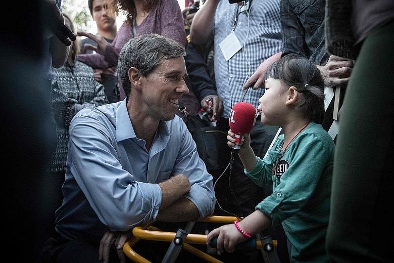 Democratic Senate candidate Beto O'Rourke being interviewed by a young supporter after a campaign rally in Dallas, Texas, last Saturday. Democrats are hoping that Mr O'Rourke might be able to knock Republican Ted Cruz off his Senate seat.