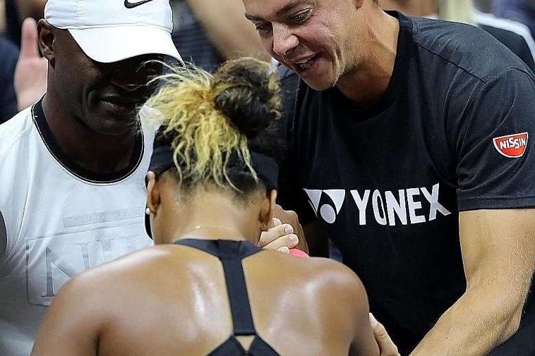 Naomi Osaka's German coach Sascha Bajin congratulating his protege after the Japanese stunned former world No. 1 Serena Williams in the final of the US Open last month to win her maiden Grand Slam title.