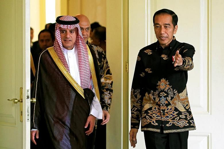 Indonesian President Joko Widodo welcoming Saudi Foreign Minister Adel al-Jubeir to the presidential palace in Bogor, West Java, yesterday. Mr al-Jubeir's visit is a follow-up to that of Saudi King Salman in March last year.