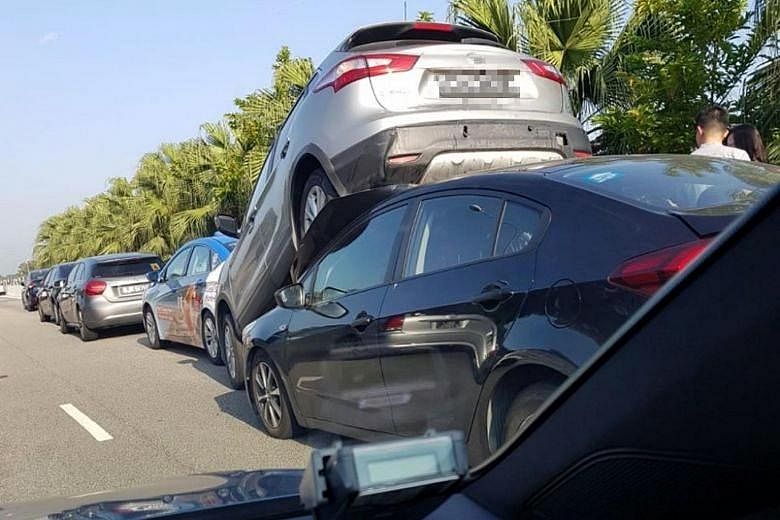 Five cars were involved in one of the two chain collisions on the Tampines Expressway yesterday during the morning peak hour. A silver car ended up being lifted in the air from behind before landing on top of a black car. No one was injured in that c