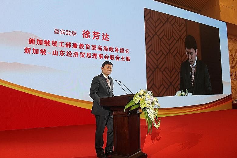 Senior Minister of State for Trade and Industry and Education Chee Hong Tat delivering a speech at the 20th Singapore-Shandong Business Council meeting yesterday. He is on a four-day visit to Shandong with 60 officials and businessmen.