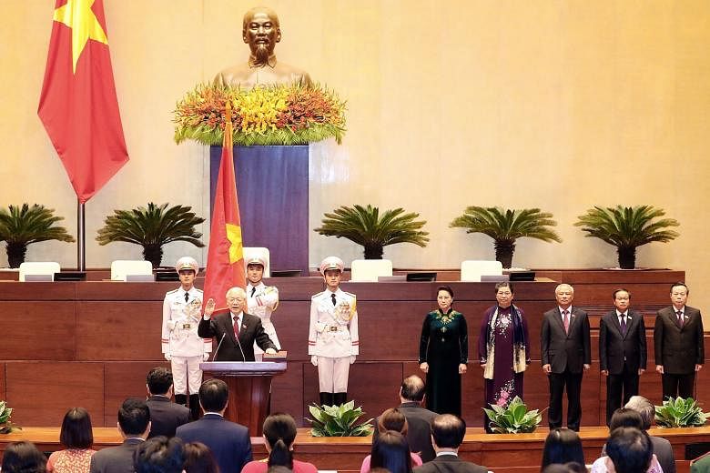 Vietnamese Communist Party general secretary Nguyen Phu Trong taking the oath of office after being elected as President of Vietnam in Hanoi yesterday. The 74-year-old asked for sympathy from the nation, citing his "worrisome" old age and health in h