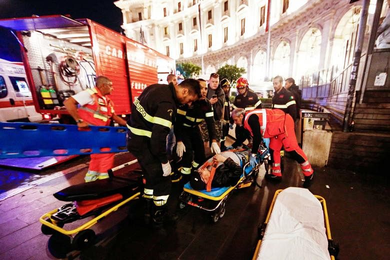 A victim being evacuated after an escalator leading to a metro station collapsed with many Russian football fans on it