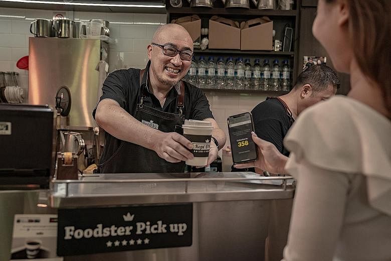 Mr Alfred Tan, director of Kopi Ong, said DBS Foodster accounts for more than 15 per cent of all his orders. Kopi Ong is one of seven outlets at Marina Bay Link Mall that have joined Foodster so far. The service lets users pre-order food and drinks v