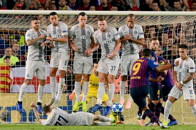 As the players in the Inter Milan wall jump as expected to defend a free kick, Luis Suarez rolls the ball below it. Thankfully, Marcelo Brozovic had already slid down and managed to block the Barcelona striker's shot during Wednesday's Champions Leag