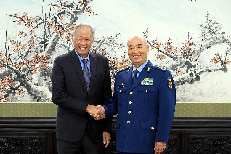 Singapore's Defence Minister Ng Eng Hen meeting General Xu Qiliang, vice-chairman of China's Central Military Commission, in Beijing yesterday. They discussed deepening military cooperation.