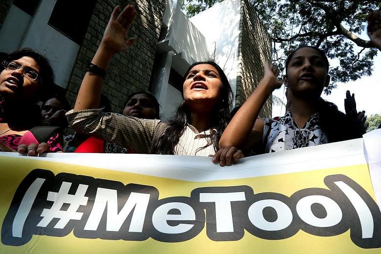 Members of the All India Mahila Samskrutika Sanghatane joined students from different colleges in holding placards as they shouted slogans on Thursday, after attending a #MeToo convention in Bengaluru, India, demanding that the security and dignity o