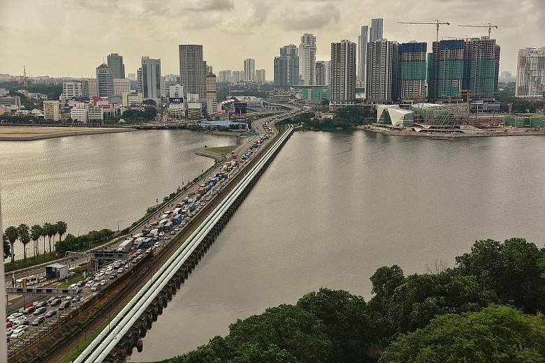 At the Tuas checkpoint, queues can be especially long during festive seasons and the wait to get across could stretch for hours. View of the Pasir Gudang industrial area in Johor from Punggol Point. The suggestion of a new bridge leading to Malaysia 