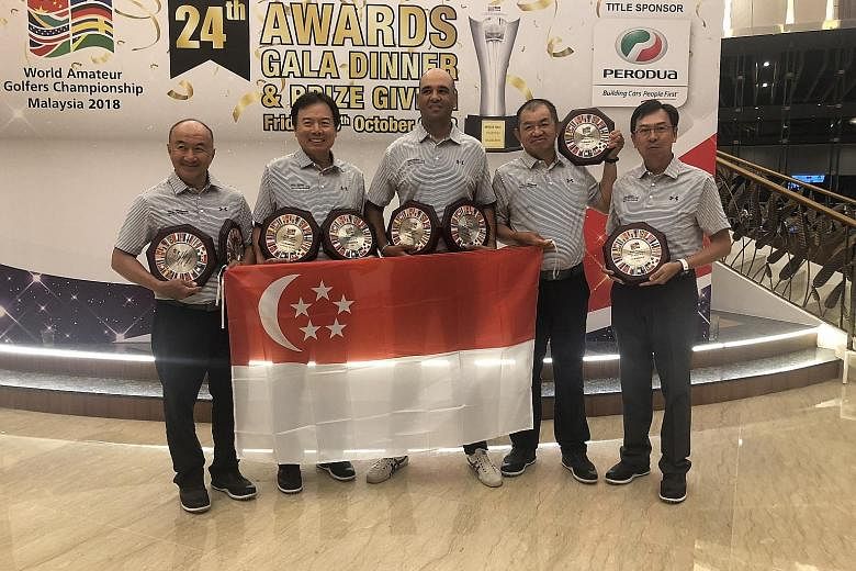 Singapore's (from left) Ricky Huang, Patrick Low, Samir Bedi, Teo Hock Guan and Ong Siew Yong with their trophies after finishing second at the World Amateur Golf Championships World Finals.