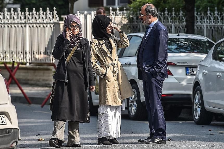 Journalist Jamal Khashoggi's fiancee, Ms Hatice Cengiz (left), and her friends waiting at the Saudi Arabian consulate in Istanbul on Oct 3, a day after he disappeared.