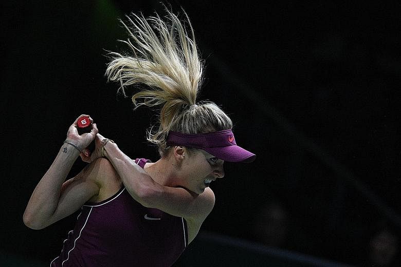 Elina Svitolina's mental toughness is on display in her expression as she hits a return to Sloane Stephens during the final of the WTA Finals yesterday. The Ukrainian dispatched her American opponent in three sets.
