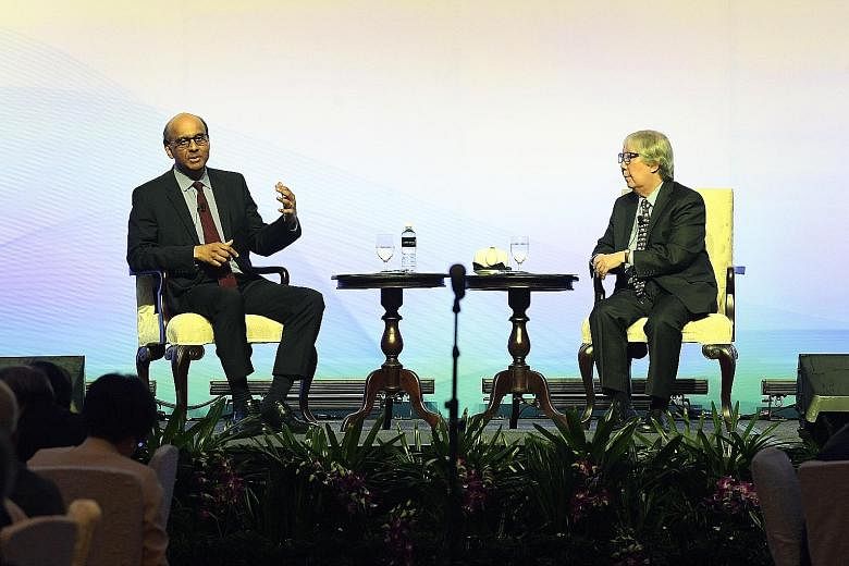 Deputy Prime Minister Tharman Shanmugaratnam and Professor Tommy Koh at the Marina Bay Sands convention centre last Thursday. They exchanged views on matters including sustaining social mobility and reducing poverty in Singapore.