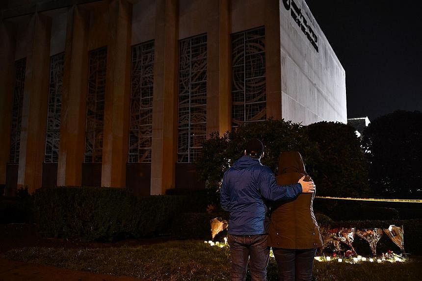 Crowds at an interfaith vigil at the Sixth Presbyterian Church after a mass shooting at the nearby Tree of Life synagogue left 11 dead in Pittsburgh, Pennsylvania, on Saturday. Robert Bowers had reportedly walked into the building and yelled "all Jew