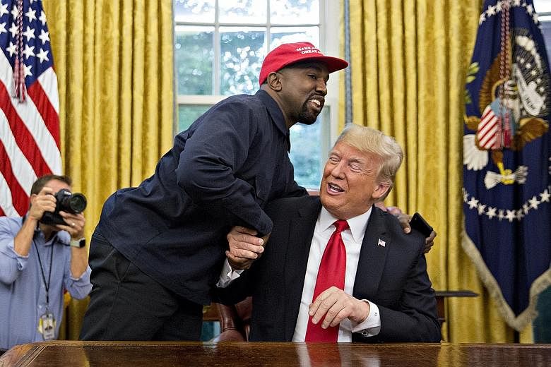 Rapper Kanye West (far left), a staunch supporter of United States President Donald Trump, meeting the latter in the Oval Office earlier this month.
