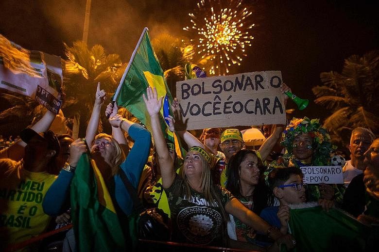 Mr Jair Bolsonaro's supporters cheering after his victory was announced on Sunday. The 63-year-old won a convincing 55.1 per cent of votes in the run-off election. Mr Jair Bolsonaro, a former army captain, has promised to gut endemic political corrup