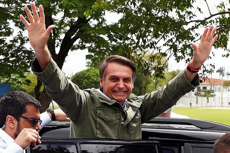 Mr Jair Bolsonaro's supporters cheering after his victory was announced on Sunday. The 63-year-old won a convincing 55.1 per cent of votes in the run-off election. Mr Jair Bolsonaro, a former army captain, has promised to gut endemic political corrup