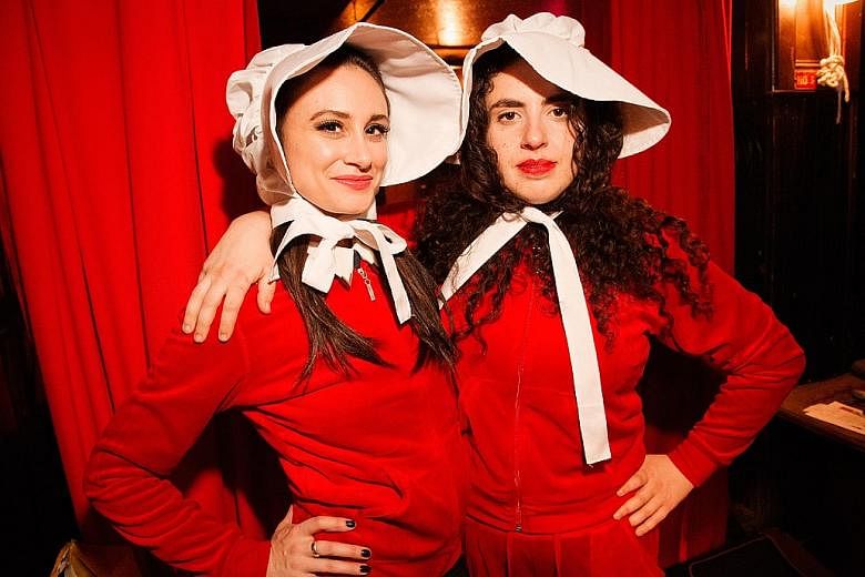 Handmaid's Tale: The Musical's co-creators Melissa Stokoski (far left) and Marcia Belsky play the central characters of Rory Gilmore and Offred in the dystopian parody.
