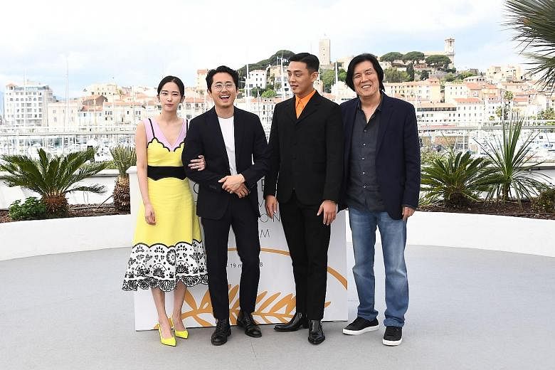 (From far left) South Korean actress Jun Jong-seo, US-South Korean actor Steven Yeun, South Korean actor Yoo Ah-in and South Korean director Lee Chang-dong at a photocall for the film, Burning, at the Cannes Film Festival in May.