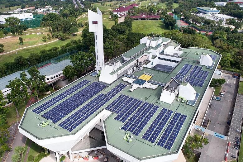 An aerial view of the solar panels on JTC's Jurong Town Hall rooftop. The panels are part of JTC's SolarRoof programme, which allows power to be pumped into the national grid from solar panels on the rooftops of the agency's buildings.