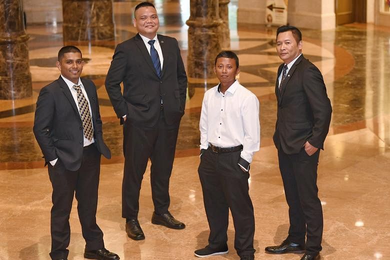 One Degree 15 Marina Sentosa Cove employees (from left) Mohd Fadhlul Rahman Abu Bakar, Mohammad Nazir Lajis, Muhamad Sunasri Samat and Azhar Hamid each received a Special Mention award yesterday for helping to put out a fire on a boat after an explos