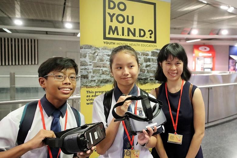 Above: Students wearing a VR headset will take on the persona of a virtual character - a girl who suffers from depression - and listen to her inner thoughts. Left: Hougang Secondary students Malabanan Ace Brendan Malones, 13, and Phoebe Teo Jianing, 