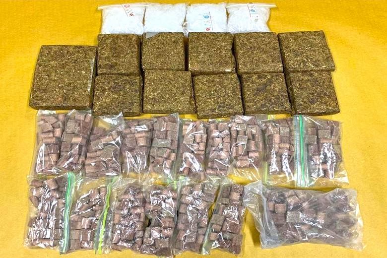 Over 5.8kg of cannabis, heroin and "ice" were found hidden in different parts of the Malaysia-registered car.
