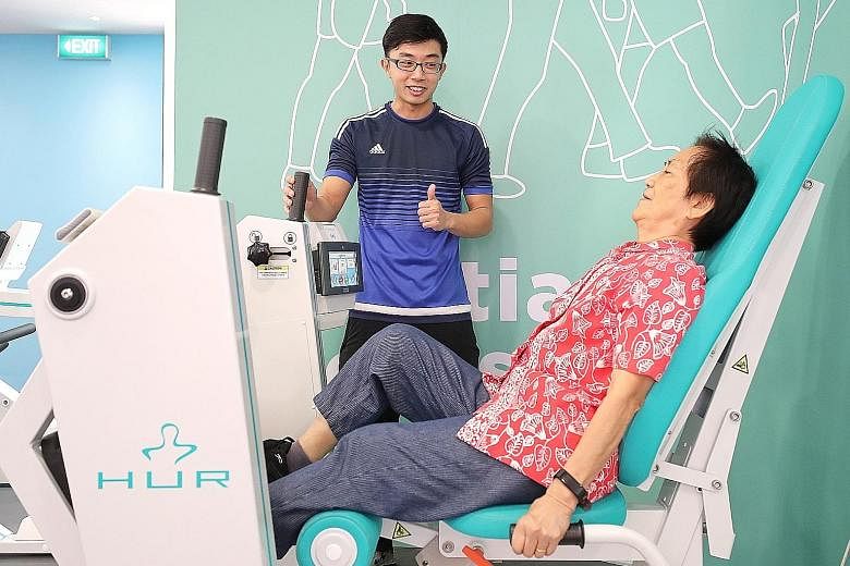 Madam Tee Ah Lui doing the Gym Tonic programme under the guidance of wellness coach Joseph Chan at Bishan Community Club yesterday. The programme at the club started in April, and 149 senior citizens have completed the programme so far.