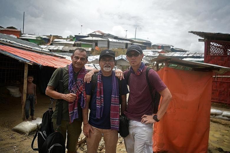 Capturing the stories of the Rohingya in the Cox's Bazar refugee camps were (from left) Straits Times associate editor Rahul Pathak; artist Pradip Kumar Sikdar, who is now a senior art director; and executive photojournalist Kua Chee Siong. The ST te