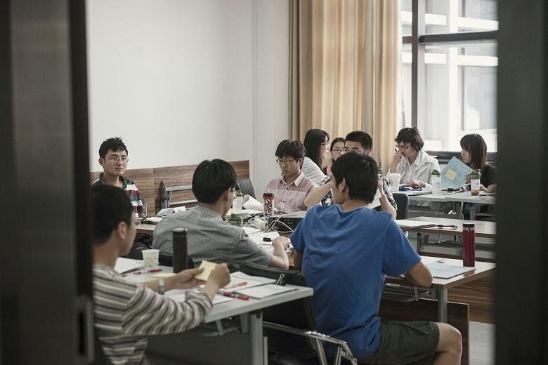 Students in a class at Renmin University. According to NYTimes, Renmin had punished at least a dozen students for defending workers' rights.