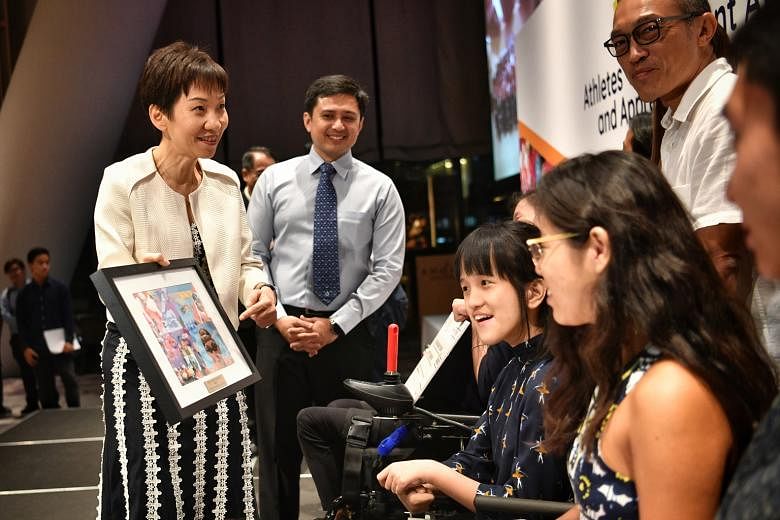 Minister for Culture, Community and Youth Grace Fu with swimmer Yip Pin Xiu (right) and boccia player Faye Lim at last night's awards ceremony.