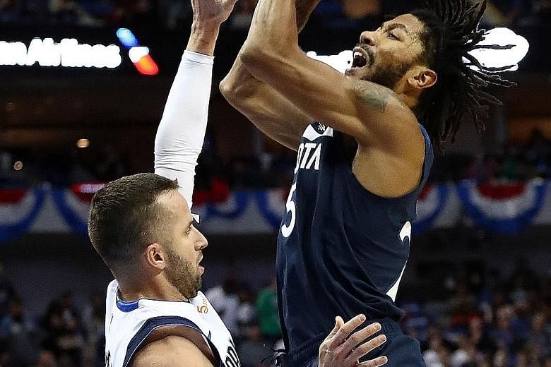 Minnesota's Derrick Rose taking a shot over Dallas' J.J. Barea in their game on Oct 20, when he set his previous season high of 28 points.