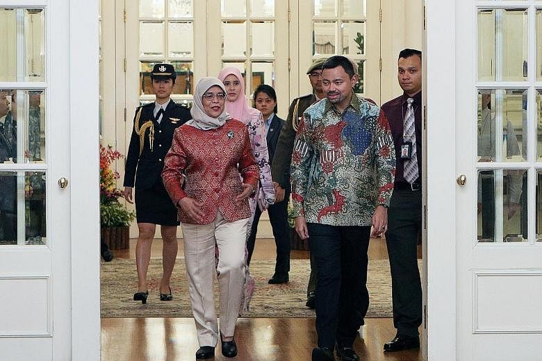 President Halimah Yacob hosted Brunei Crown Prince Haji Al-Muhtadee Billah and his wife, Paduka Seri Pengiran Anak Isteri Pengiran Anak Sarah, to tea at the Istana (left) yesterday. Crown Prince Billah is on an official visit to the Republic and is l