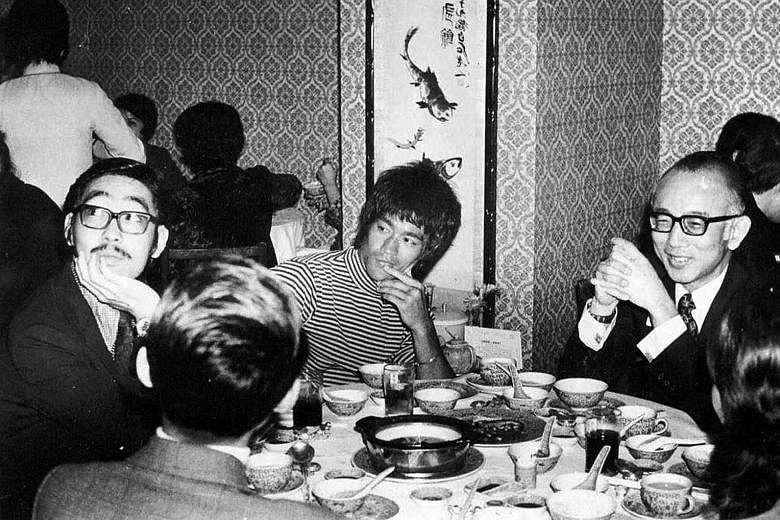 (From left) Mr Robert Chua, Bruce Lee and and Mr Raymond Chow in a 1972 photo. Mr Chow introduced Lee to the world after the late gongfu star appeared on popular variety show Enjoy Yourself Tonight.