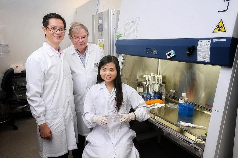 Dr Alvin Chua (left), deputy head of the Skin Bank Unit at SGH's Department of Plastic, Reconstructive and Aesthetic Surgery, with Professor Karl Tryggvason and research fellow Monica Suryana Tjin from Duke-NUS Medical School's Cardiovascular and Met