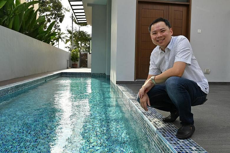 Mr Darren Teo and his favourite part of his Seletar Hills Estate home - the swimming pool, which has an in-built jacuzzi.