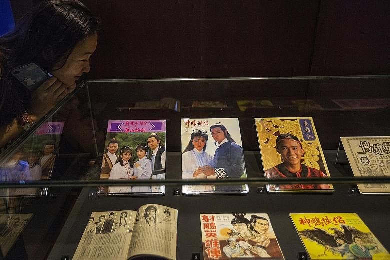 Memorabilia on display at the Jin Yong Gallery in Hong Kong Heritage Museum. Martial arts novelist Louis Cha's works have been adapted into movies, TV dramas, radio serials and even video games over the years.