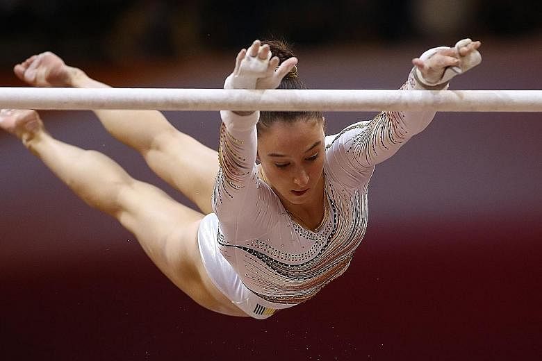The gold that got away from Simone Biles was won by Nina Derwael (above), whose high-energy, uneven bars routine secured a score of 15.200 to make her Belgian's first world champion.
