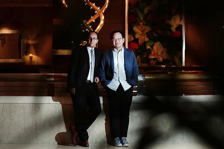 Professor Kapil R. Tuli (far left) and Mr Mark Wee. Mr Wee said: "To get people to come out to the malls, they have to offer something else that is experiential and sensory."