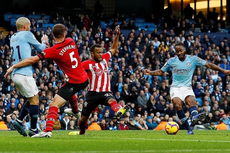 Raheem Sterling scoring Manchester City's fourth goal on the stroke of half-time in their 6-1 rout of Southampton at the Etihad Stadium yesterday. The England international added another in the 67th minute as Pep Guardiola's men moved back to the top