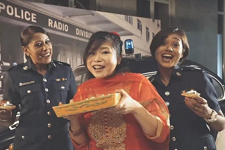 Top: The Deepavali video being performed by the Singapore Police Force. Above, from left: Staff Sergeant Priya Vamen, Deputy Superintendent Magdalene Ong and Sergeant Syafiqah Abdul Aziz sang most of the remixed Tamil song, which was subtitled in Eng