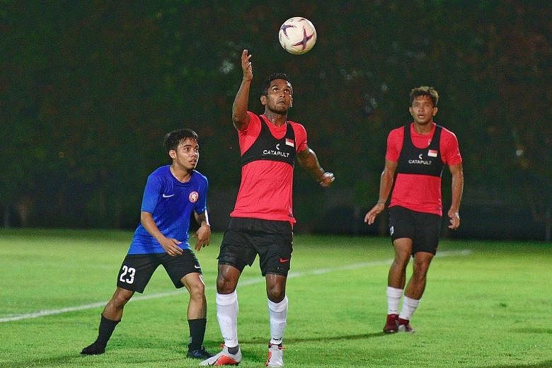 Hariss Harun (centre) is now the captain of the Lions. He had been Singapore's youngest debutant at 16 years and 217 days in 2007.