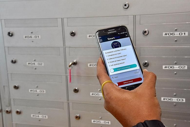 Left: All of SingPost's 1,000 postmen will use a mobile app for deliveries from January next year. Above: The app helps in tracking delivery and e-signing for registered mail.