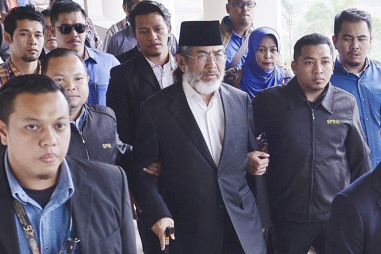 Former Sabah chief minister Musa Aman arriving at the Kuala Lumpur Court Complex yesterday to answer charges of corruption against him. He was granted bail of $660,000 with two sureties and ordered to surrender both his civil and diplomatic passports