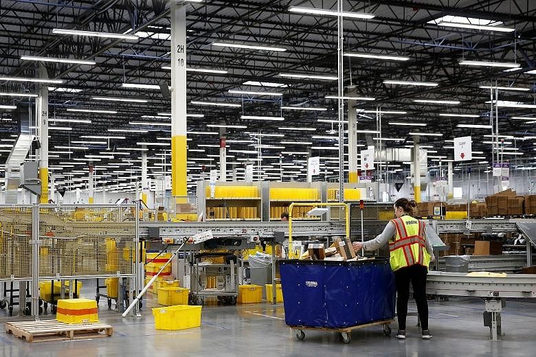 An Amazon fulfilment centre in the US. The world's largest online retailer sparked a bidding frenzy in September last year when it said it would invest more than US$5 billion (S$6.9 billion) over almost two decades in an "HQ2" in addition to its home