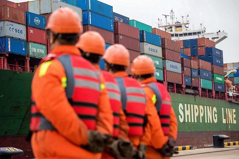 A cargo ship docking at a port in Qingdao in east China's Shandong province, yesterday. Chinese exports to the US surged 13.2 per cent last month from the same period last year, according to the data released by China's Customs administration.