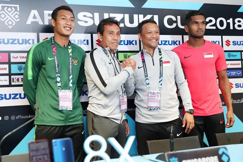 Posing ahead of their AFF Suzuki Cup group-stage clash are (from far left) Indonesia captain Hansamu Yama, Indonesia national coach Bima Sakti, Lions interim national coach Fandi Ahmad and Lions captain Hariss Harun.